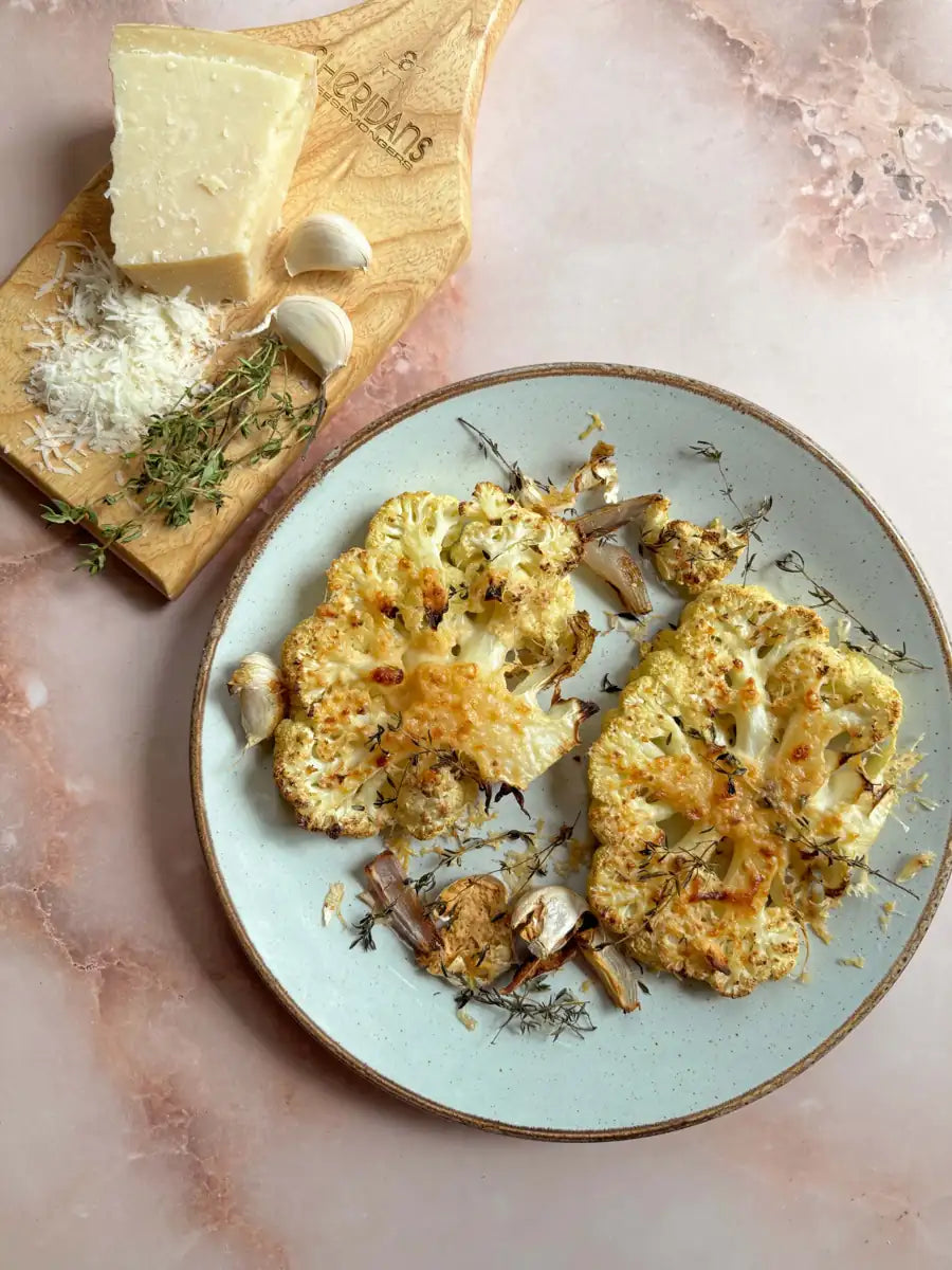 Plate of parmesan roasted cauliflower on a pale green plate