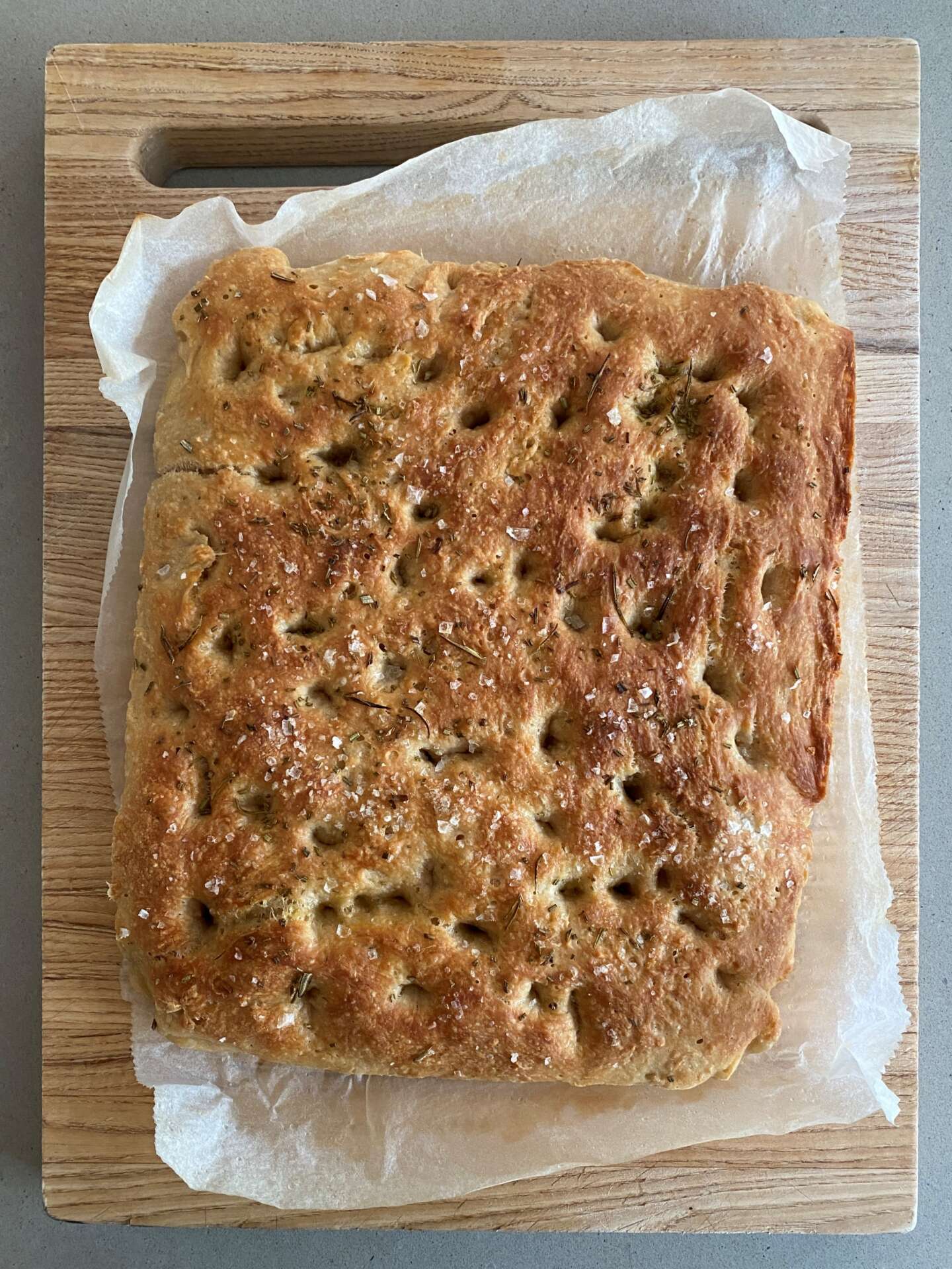 Tray of freshly baked focaccia on parchment