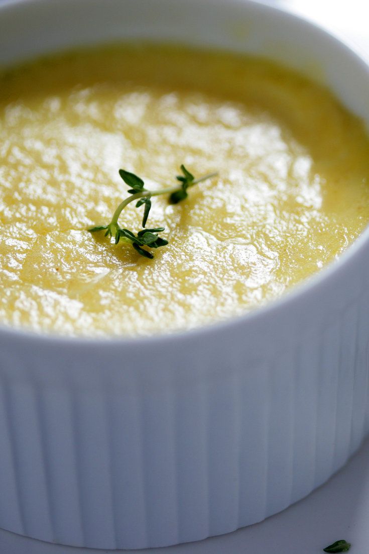 Baked parmesan and Gruyère savoury custard in a white ramekin with cress