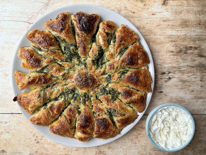 Spinach and St Tola tarte soleil with a bowl of soft cheese