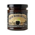 Jar of Irish Black Butter with a black lid on a white background