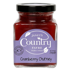 Jar of cranberry chutney with a purple label on a white background