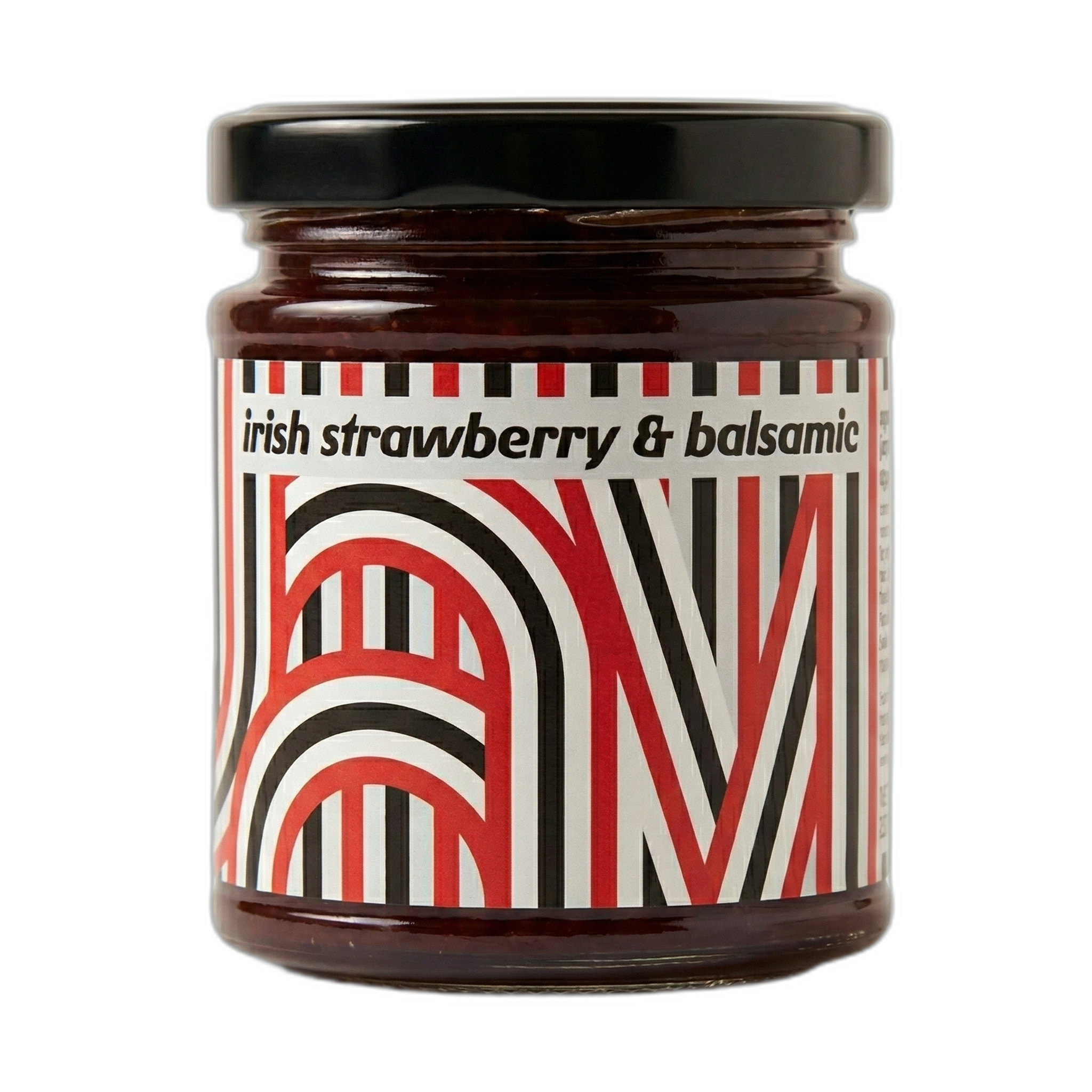 Jar of Irish strawberry and balsamic jam with a decorative label on a white background