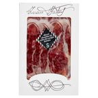 Packaged sliced shoulder of cebo de campo iberico with brand name on white background