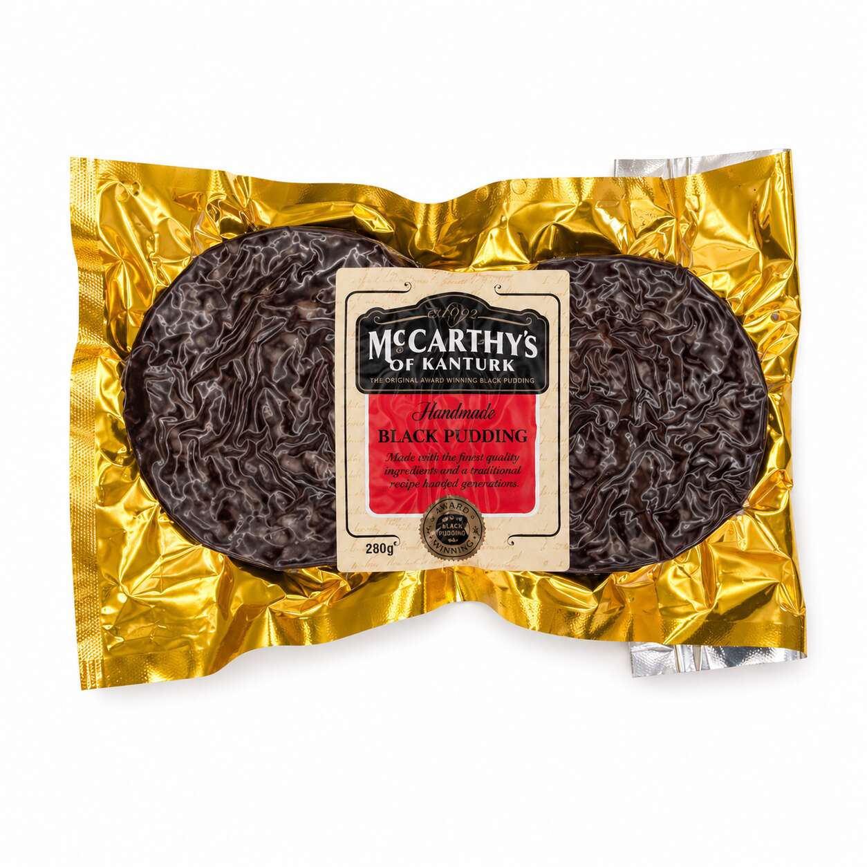 Packaged black pudding with a gold foil wrapper on a white background