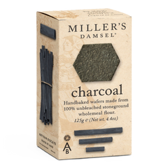 Box of Miller's Damsel charcoal handbaked wafers on a white background