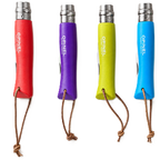Four small folding pocket knives with colorful handles in red, purple, yellow, and blue, shown alongside one open green knife on a plain white background. The handles have brown lanyard loops and the blades are silver metal.