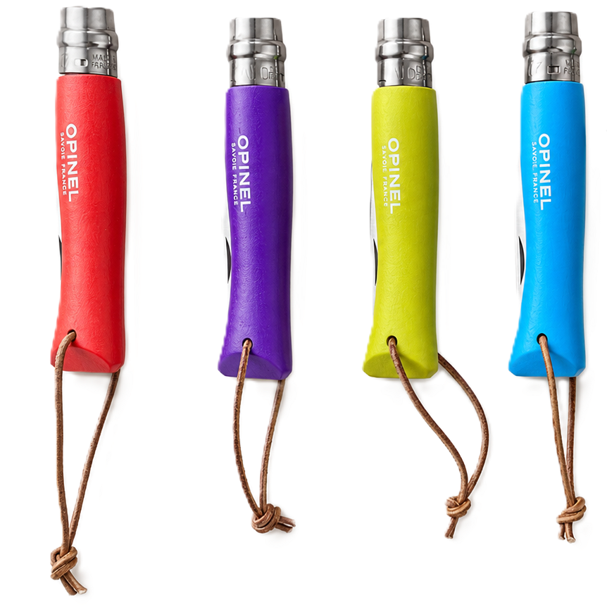 Four small folding pocket knives with colorful handles in red, purple, yellow, and blue, shown alongside one open green knife on a plain white background. The handles have brown lanyard loops and the blades are silver metal.