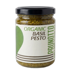 Jar of organic basil pesto with a Prunotto label on a white background