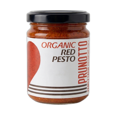 Jar of organic red pesto with prunotto label on a white background