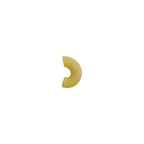 Half of a yellow pasta shell on a white background