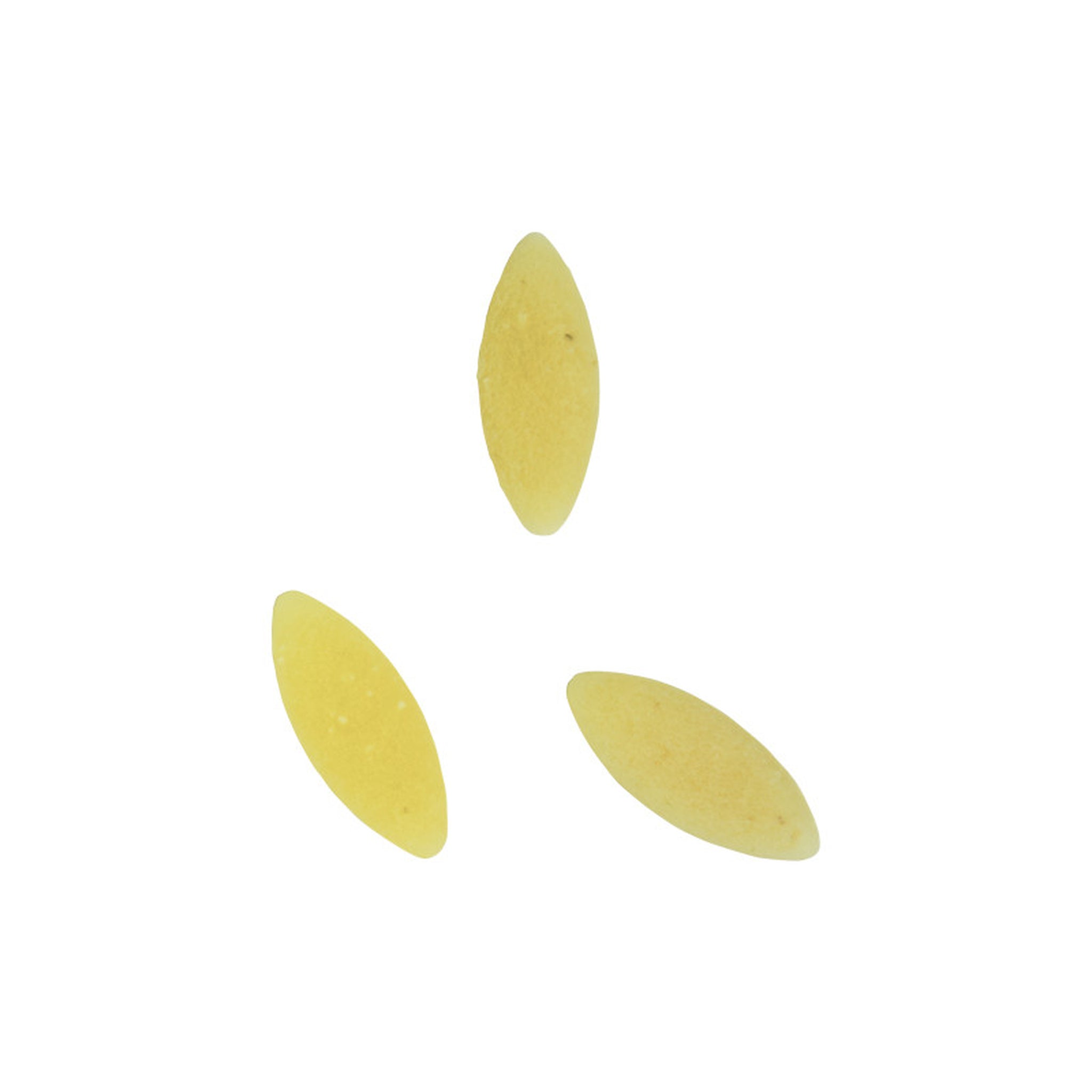 Three yellow pasta shells on a white background