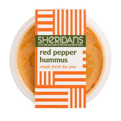 Container of red pepper hummus with Sheridan's Cheesemongers label on a white background