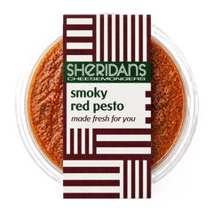 Container of smoky red pesto with Sheridan's Cheesemongers packaging on a white background