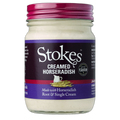 Jar of Stokes Creamed Horseradish with purple label and pink lid on white background