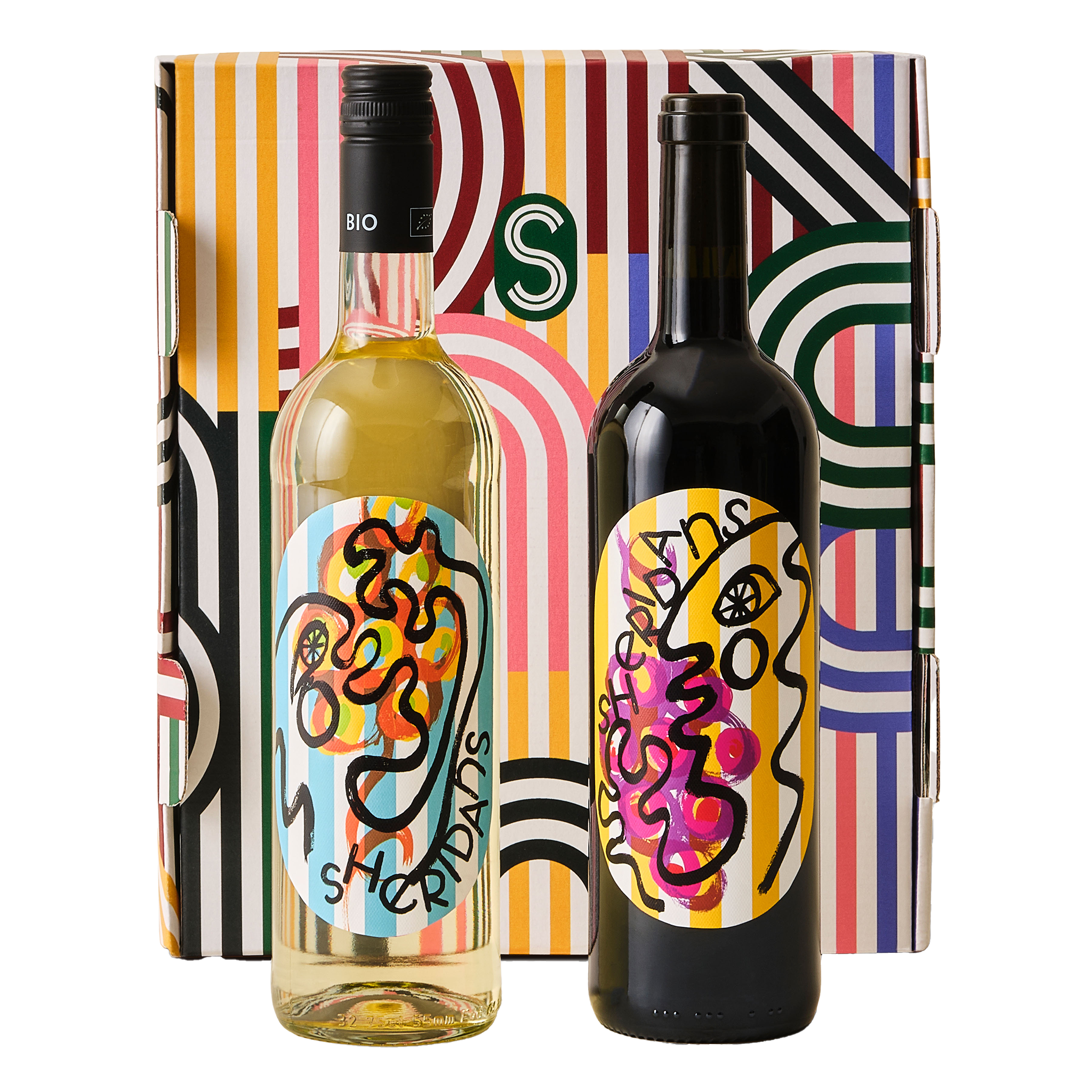 Two wine bottles with colorful labels in front of a patterned box.