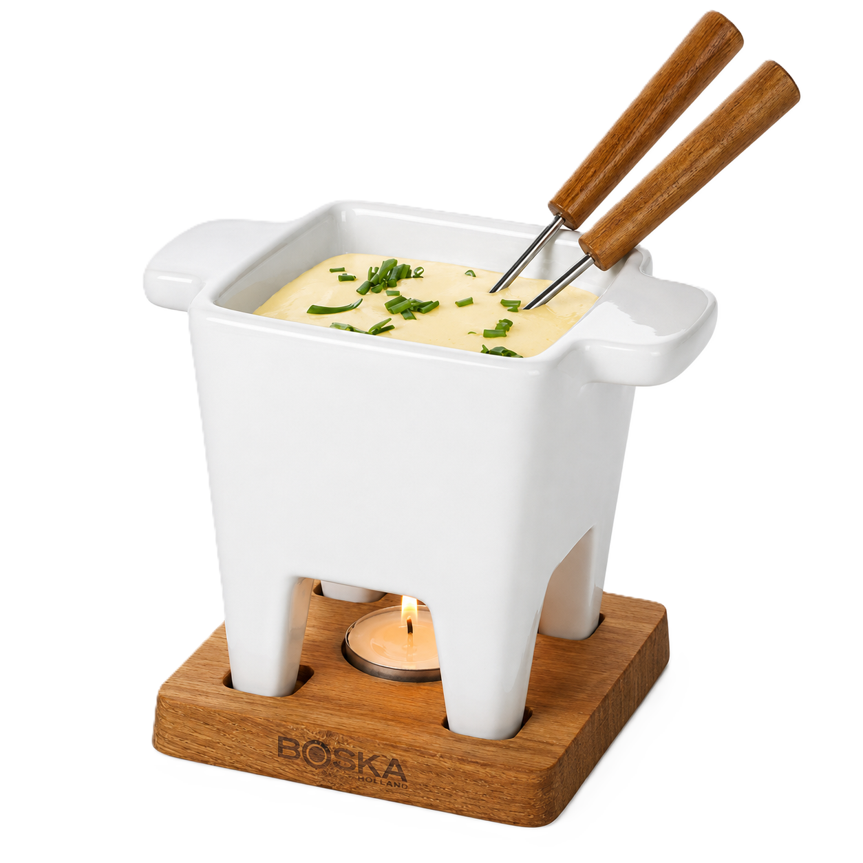 White fondue pot with wooden handles on a wooden base, filled with cheese fondue and garnished with herbs.
