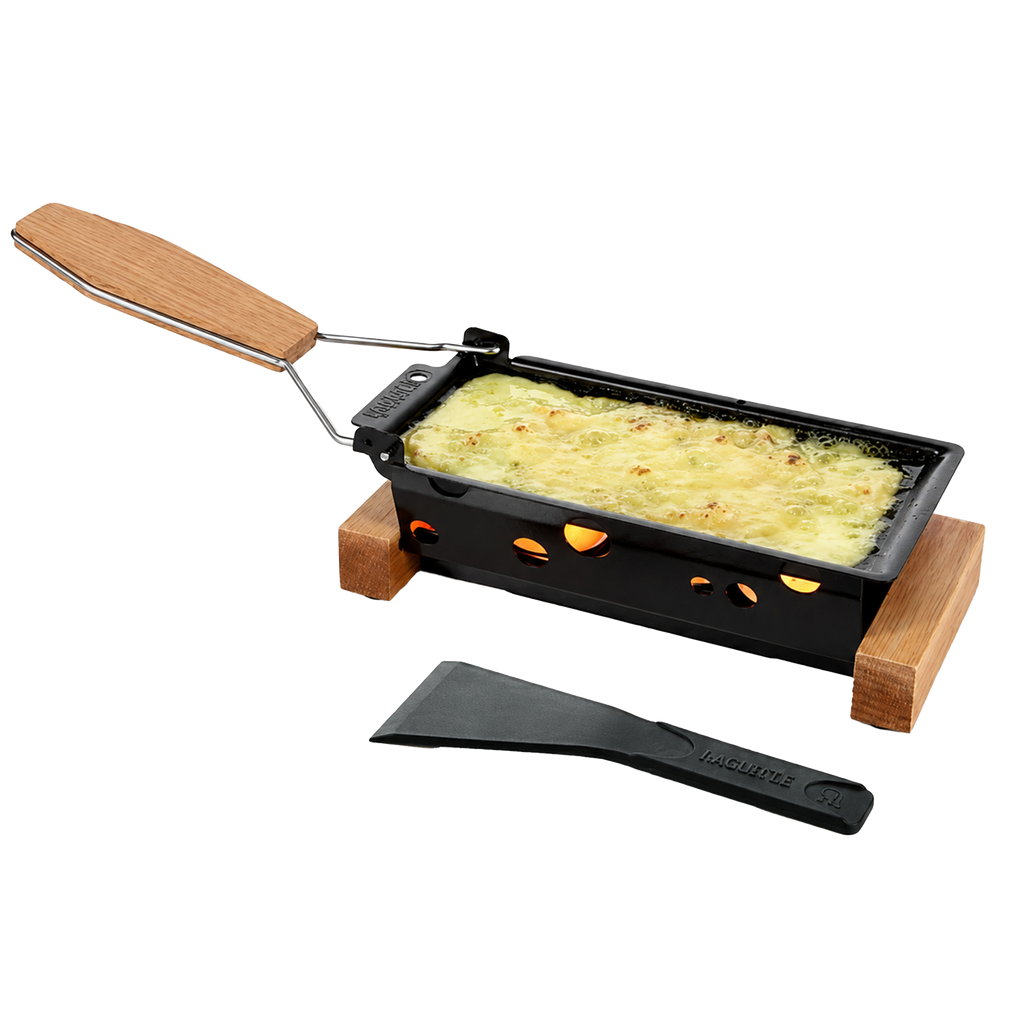 Black raclette grill with wooden handle and spatula on a white background